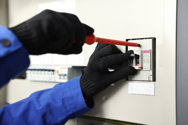 Electrician installing an electrical switchboard