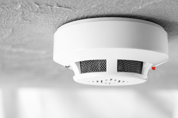 Smoke alarm installed on a residential ceiling